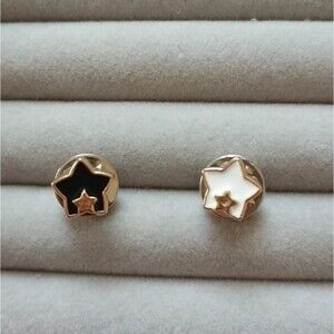 Black and white Star in star brooch/pins